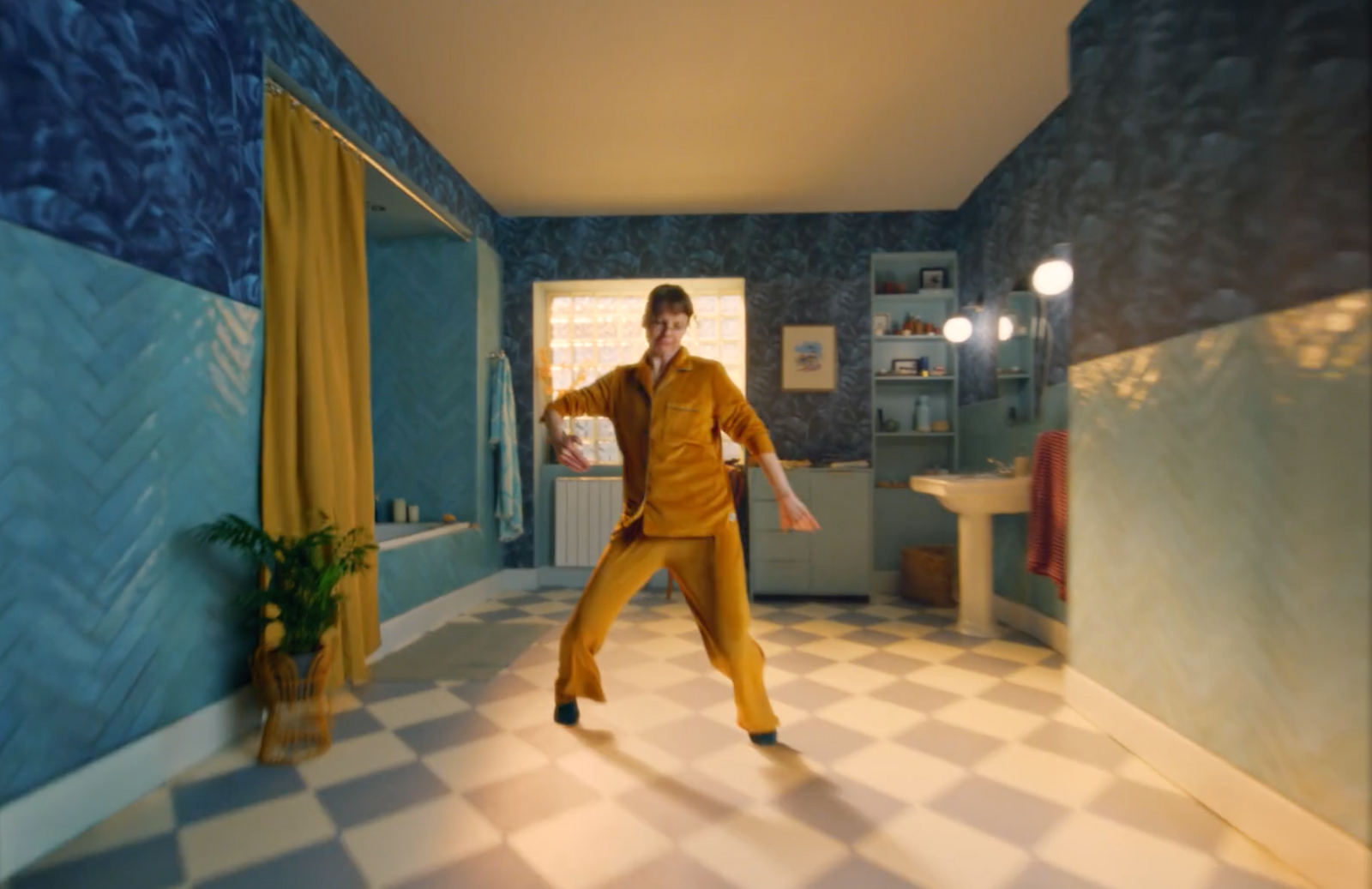 a man in a room with a checkered floor