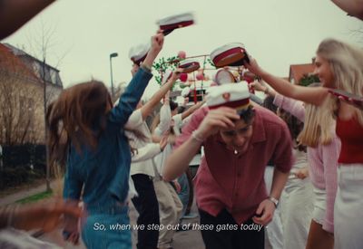 a group of people standing around each other