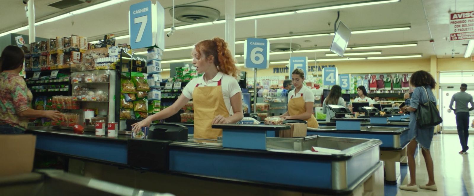 a woman standing at a counter in a store