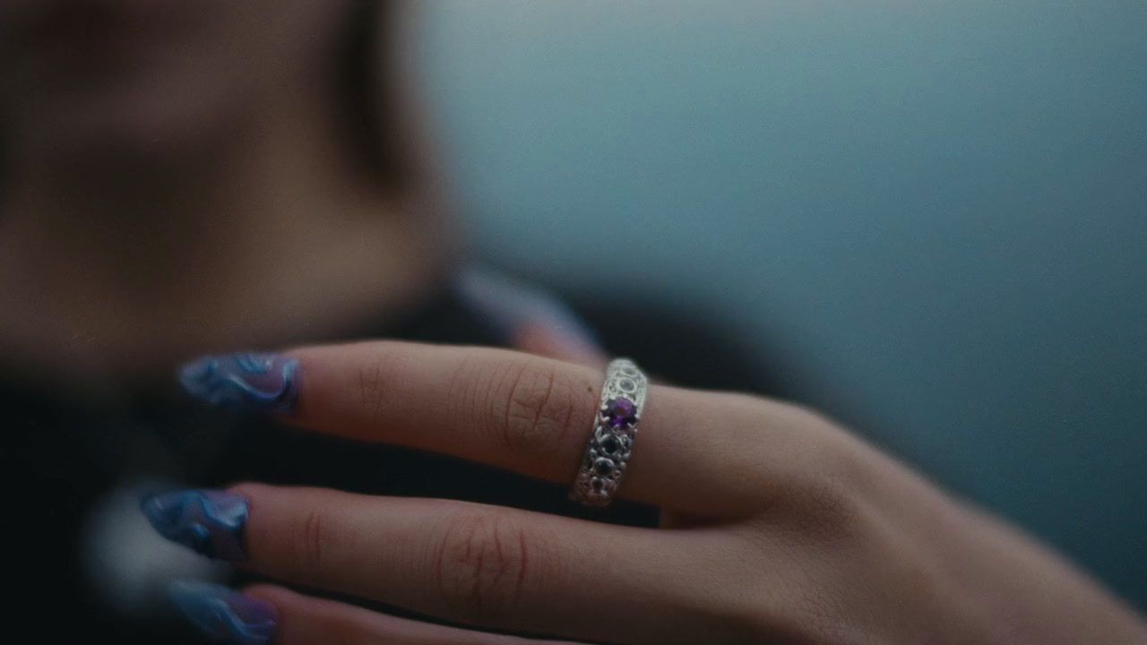 a woman's hand with a ring on it