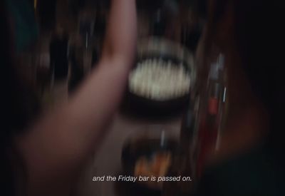 a blurry photo of a person holding a cell phone