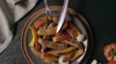 a plate of food with a knife and fork in it