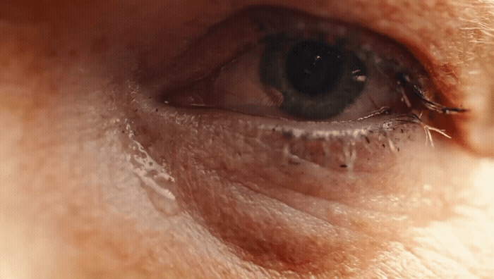 a close up of a person's blue eye