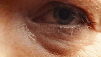 a close up of a person's blue eye