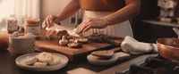 a woman is preparing food on a cutting board