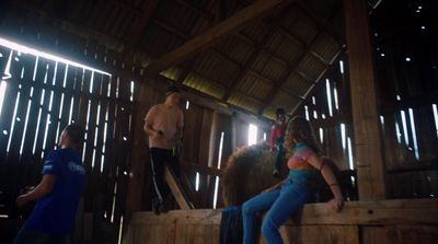 a group of people standing around a wooden structure