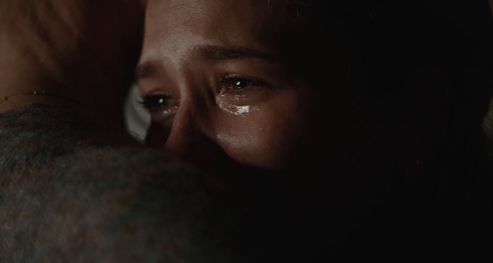 a close up of a person with a tear on their face