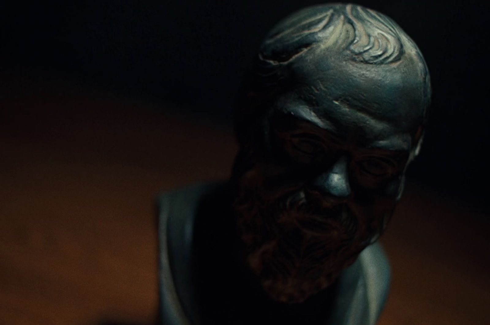 a close up of a statue of a man with a beard