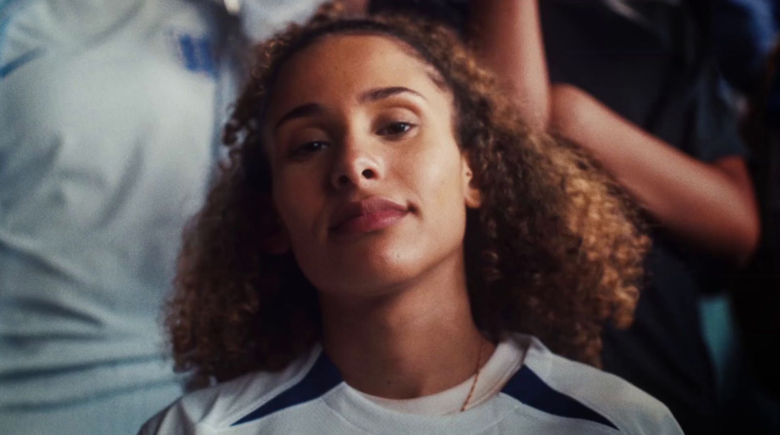 a close up of a person with curly hair