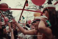 a group of people standing around each other