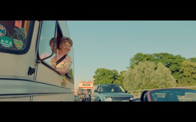 a woman is looking out the window of a bus