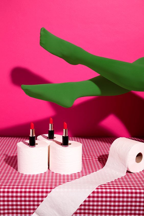 three rolls of toilet paper sitting on top of a table