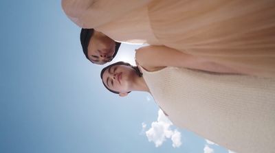 a man and a woman looking up at the sky