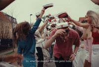 a group of people standing around each other