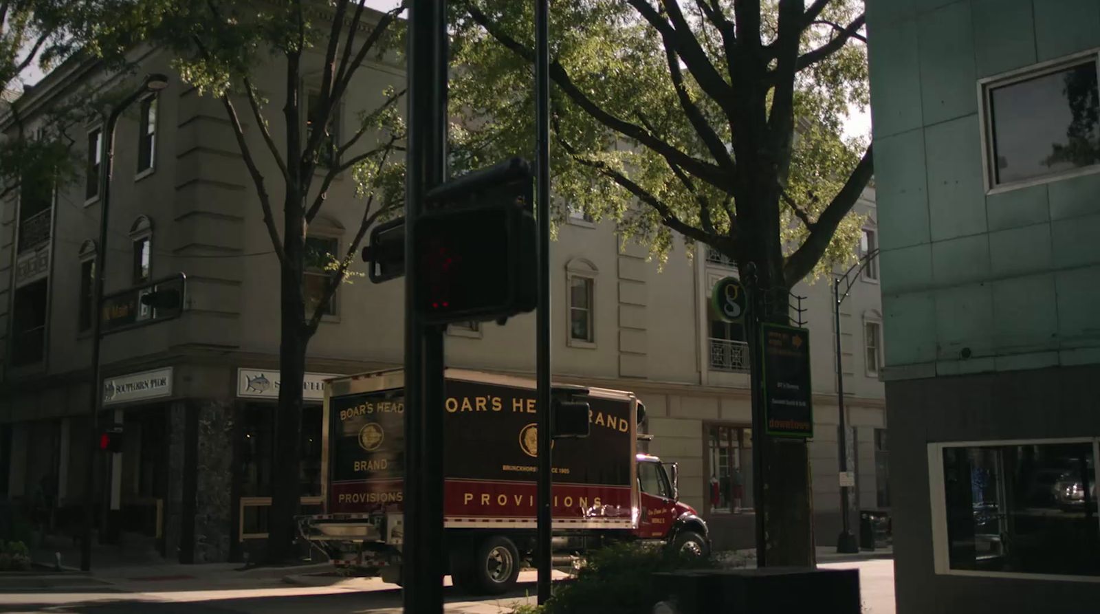 a truck is parked on the side of the street