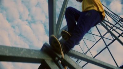 a man riding a skateboard up the side of a metal structure