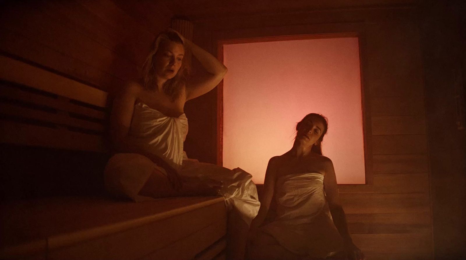 a couple of women sitting next to each other