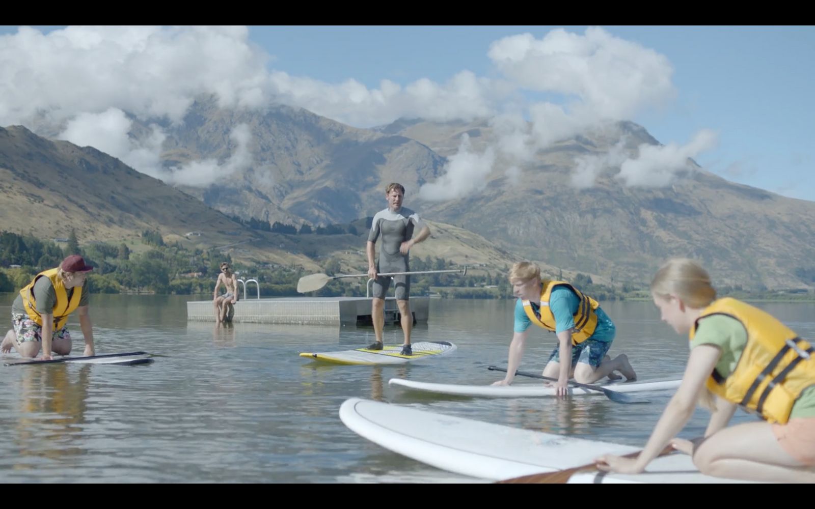 a group of people on surfboards in the water