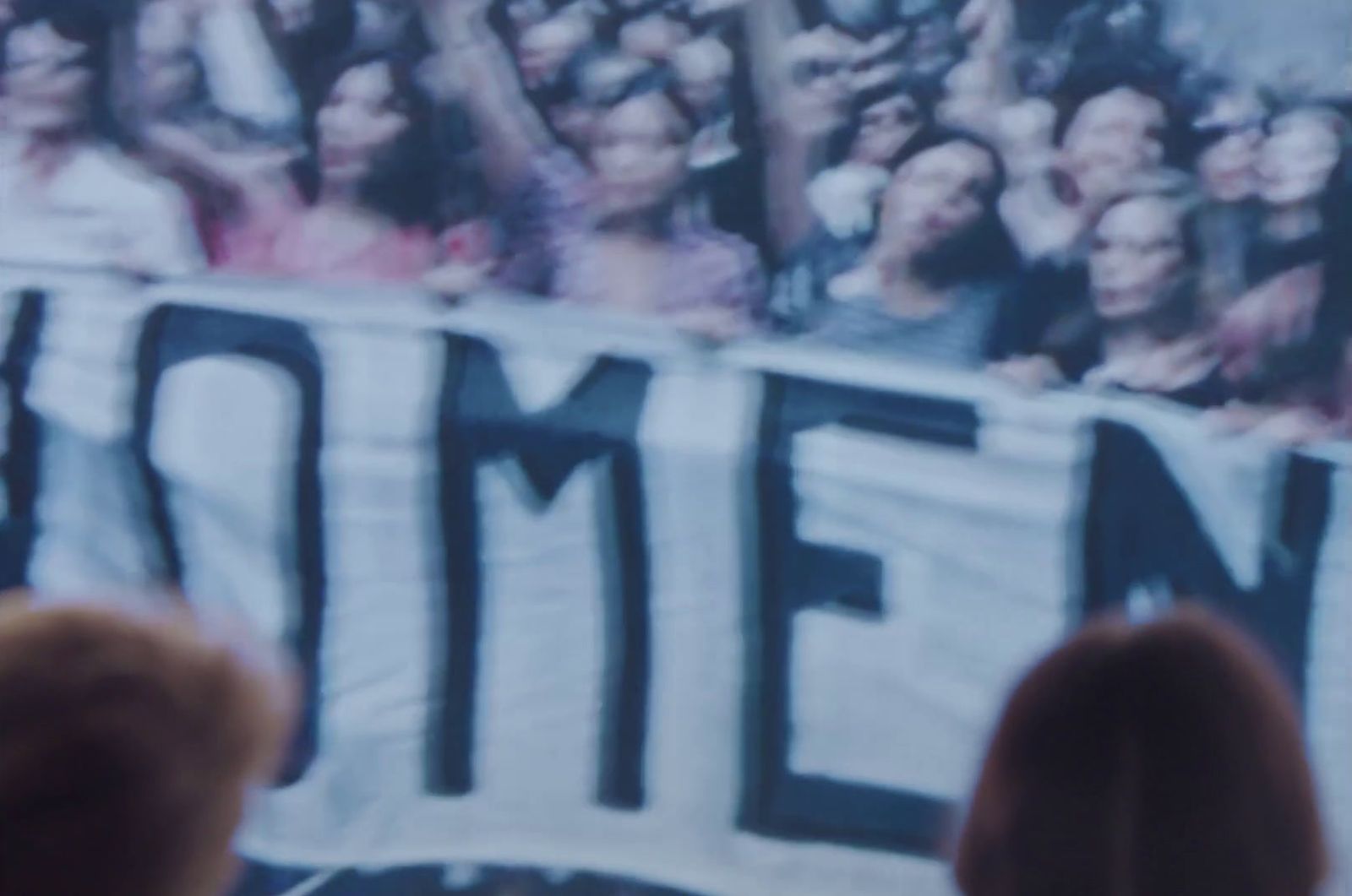 a crowd of people watching a television show