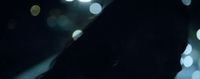 a blurry photo of a person holding a cell phone