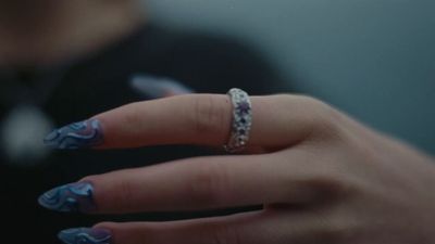 a woman's hand with a ring on it