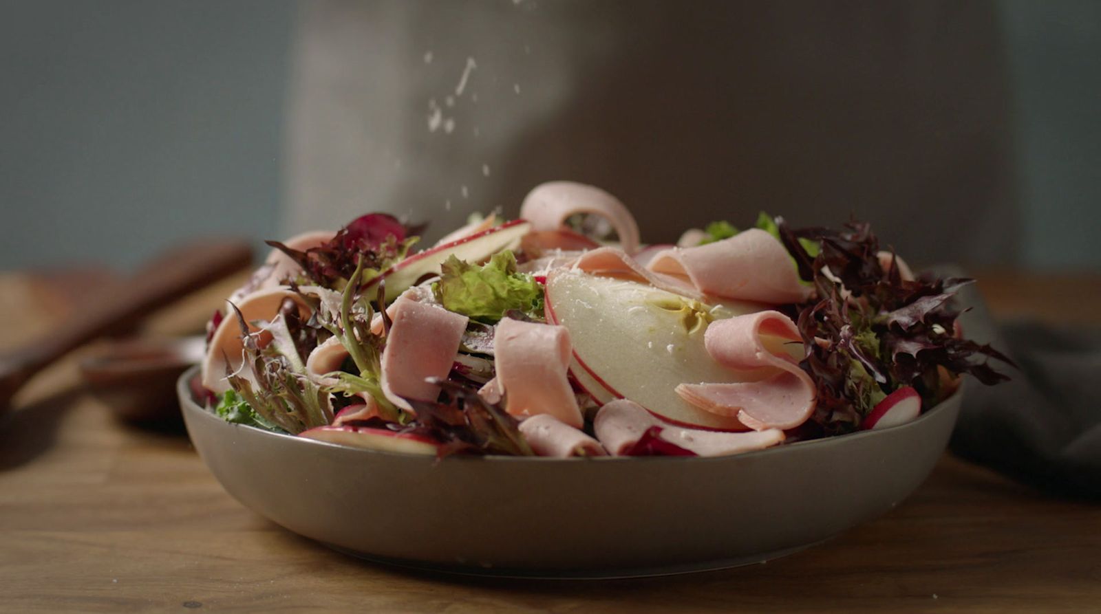 a close up of a bowl of food on a table