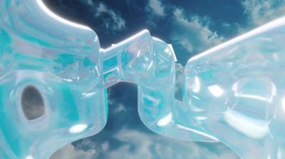 a close up of an ice sculpture with clouds in the background