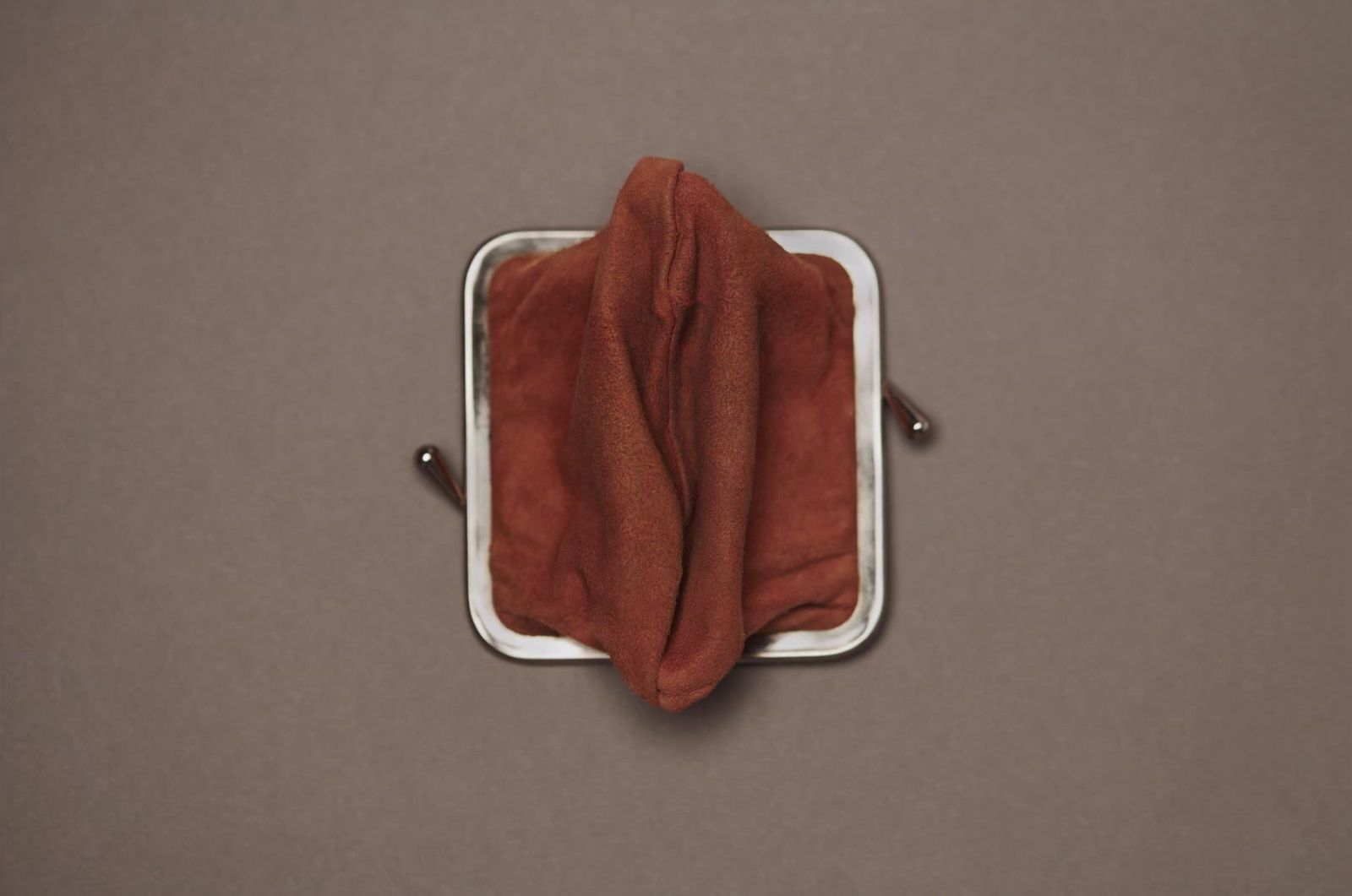 a square object with a brown cloth on top of it