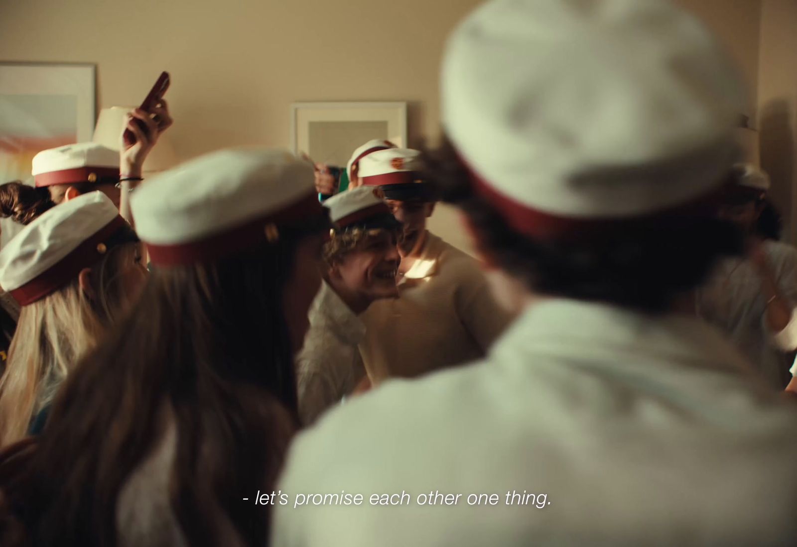 a group of people wearing white hats in a room
