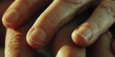 a close up of a person's hands holding something