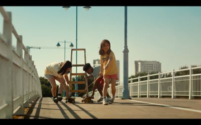 a group of people standing on top of a bridge