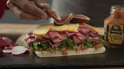 a sandwich with meat, cheese, and lettuce