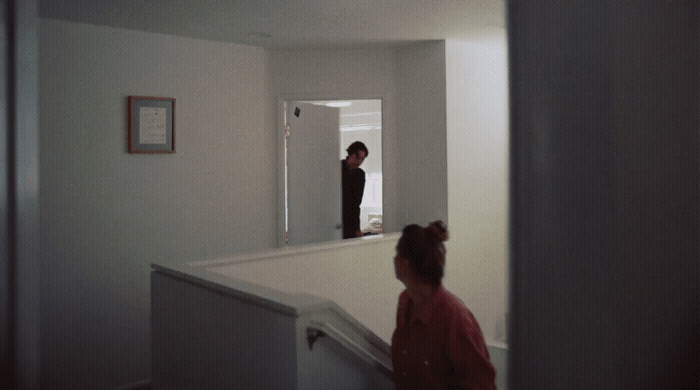 a couple of people that are standing in a room