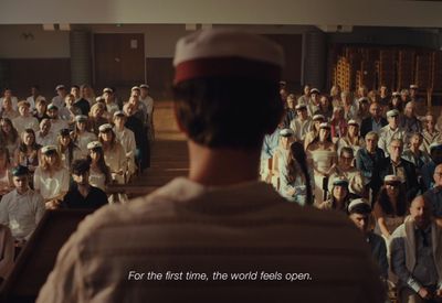 a man standing in front of a crowd of people