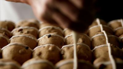 a close up of a person putting something in a tray