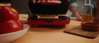 a close up of a person preparing food on a counter