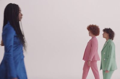 a group of women walking down a runway