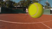 a tennis player swinging a racket at a tennis ball