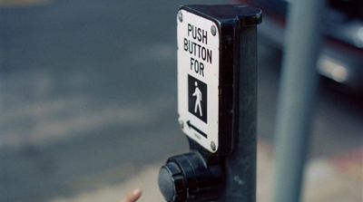 a close up of a street sign on a pole