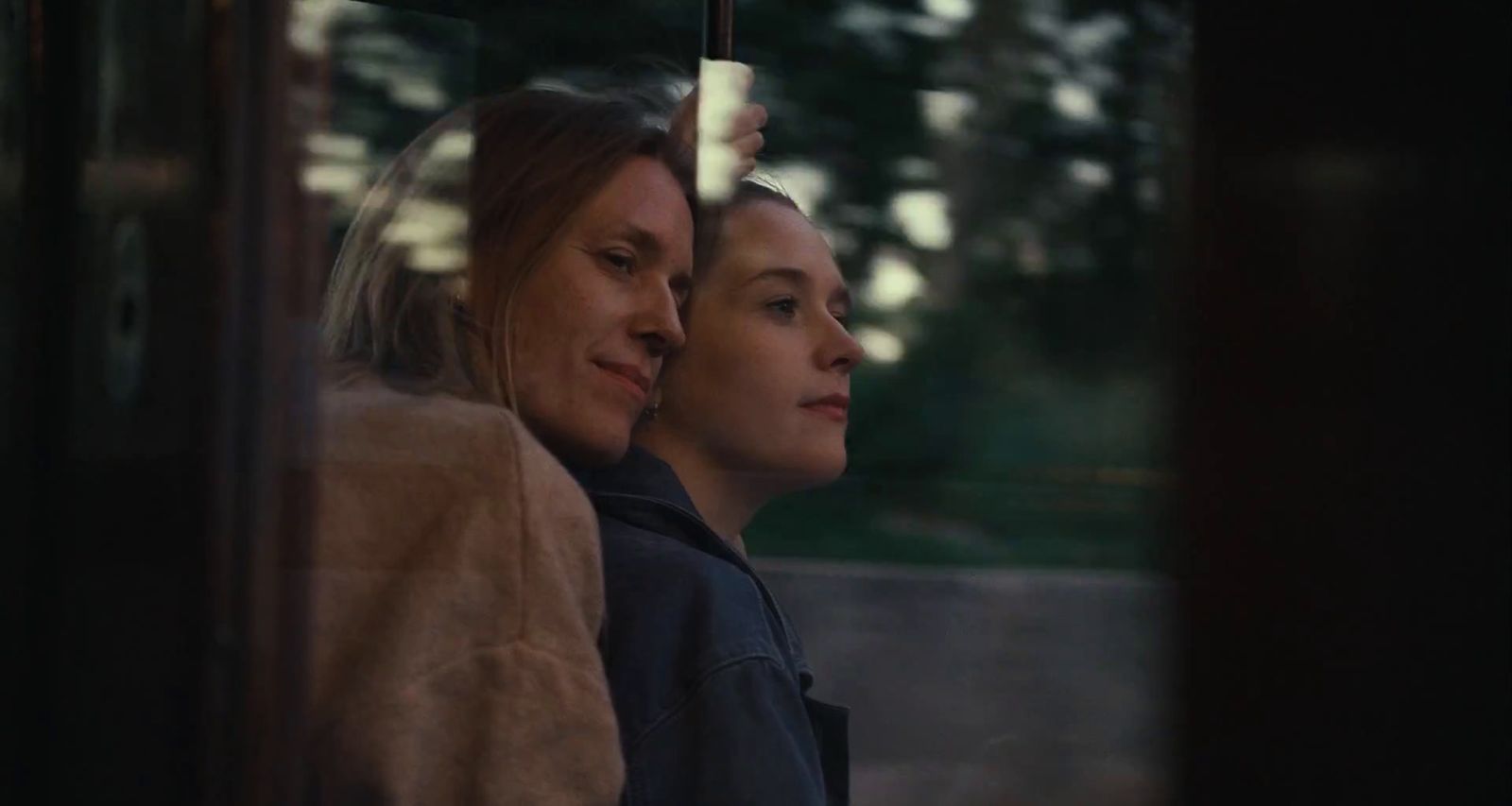 a couple of women sitting next to each other