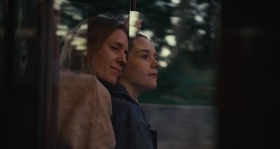 a couple of women sitting next to each other