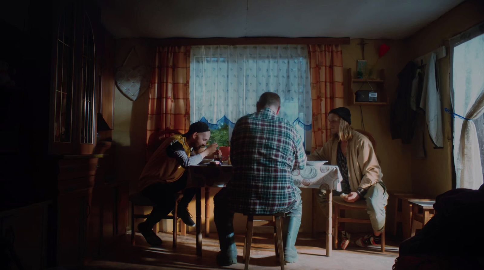 a group of people sitting around a table in a room