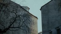 a couple of tall buildings sitting next to each other