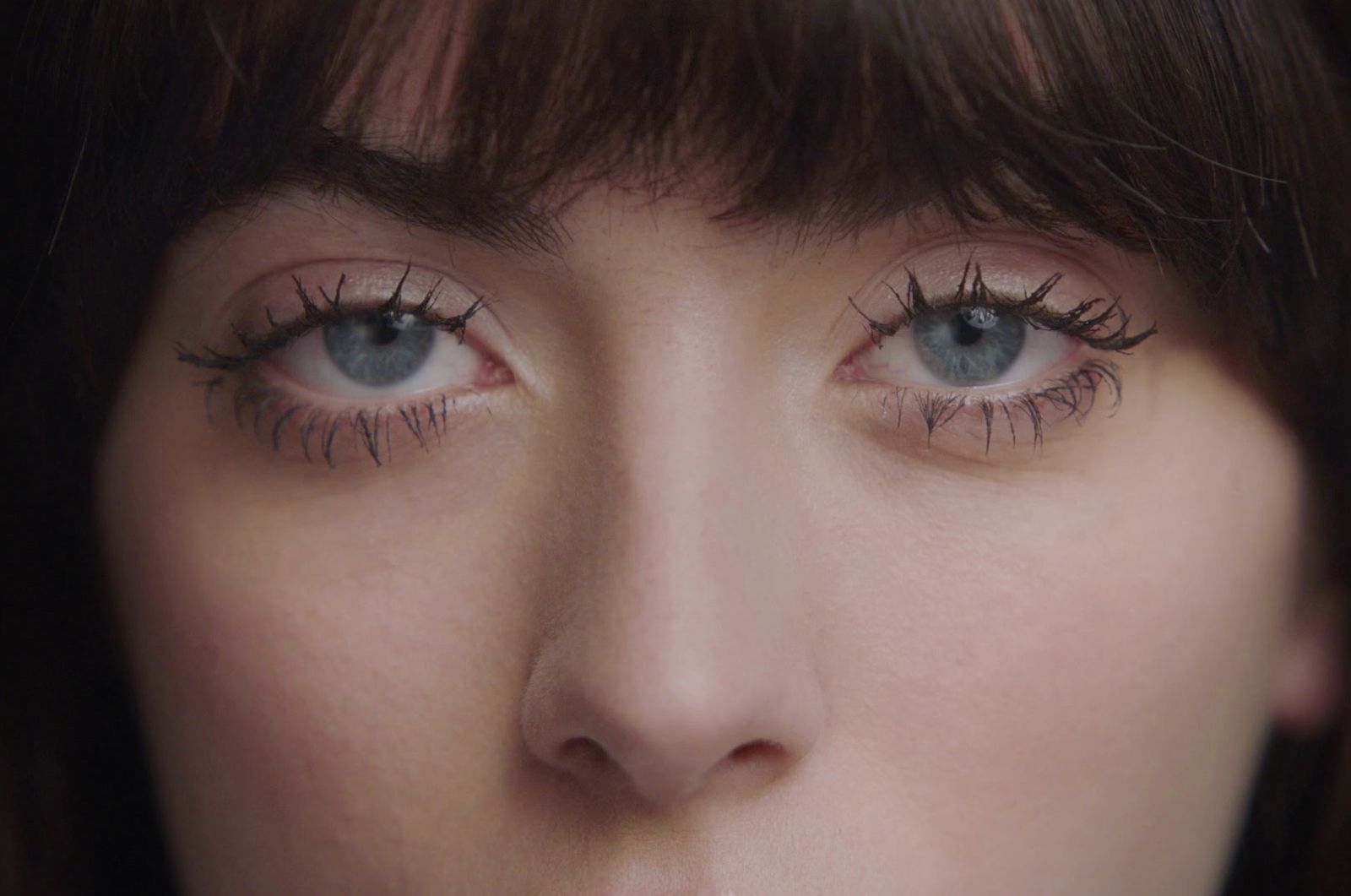 a close up of a person with long eyelashes