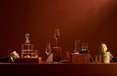 a table topped with bottles and glasses of wine