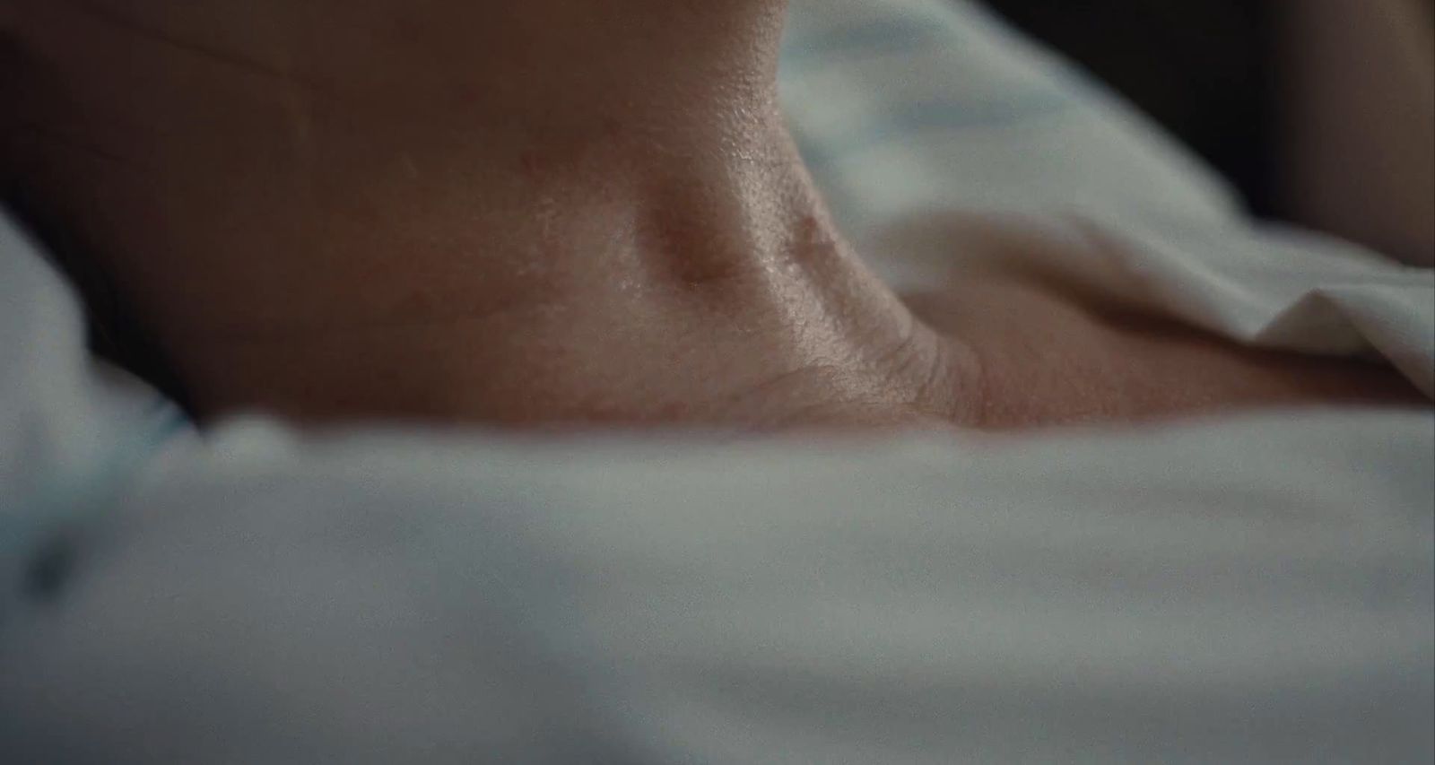 a close up of a person laying in a bed