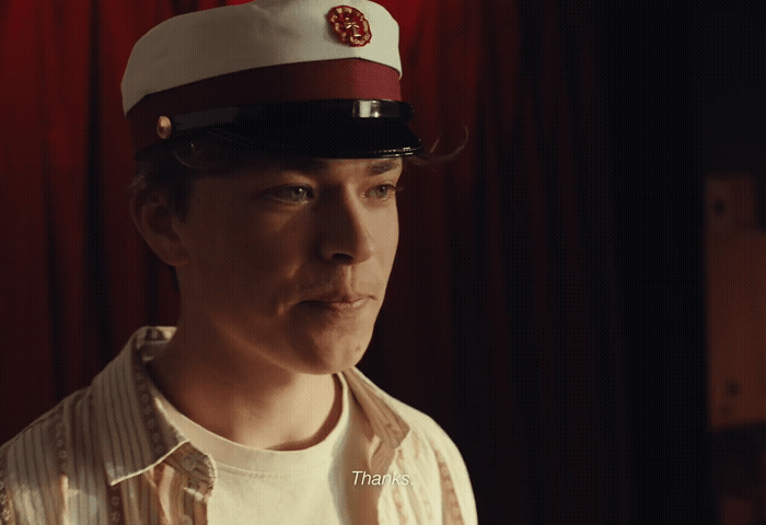 a man in a sailor's hat making a funny face