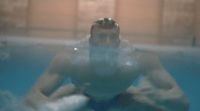 a man sitting in a pool of water