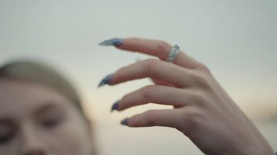 a woman with a ring on her finger