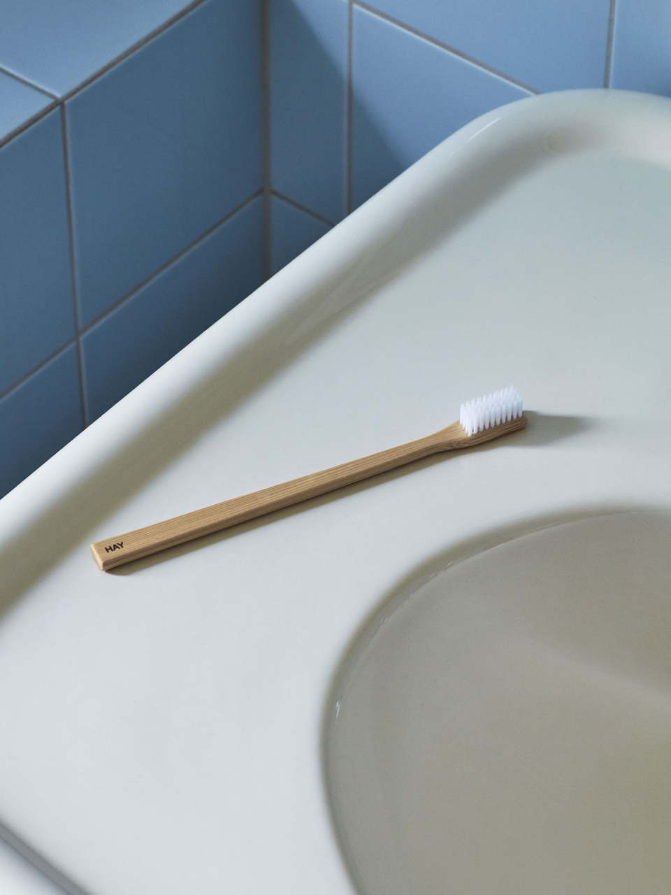 a toothbrush sitting on top of a bathroom sink